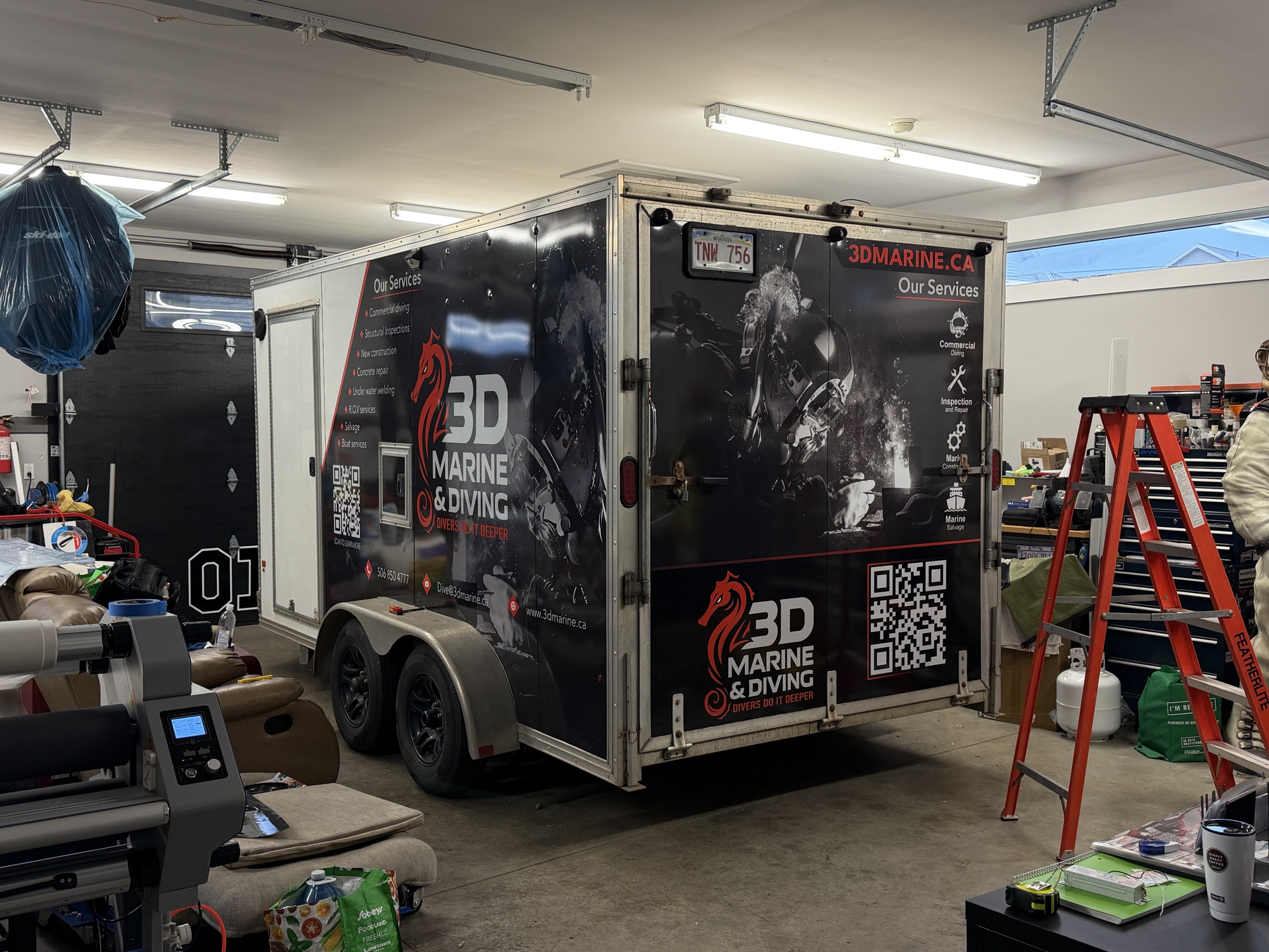 3D Marine and Diving enclosed trailer with a full custom vinyl wrap